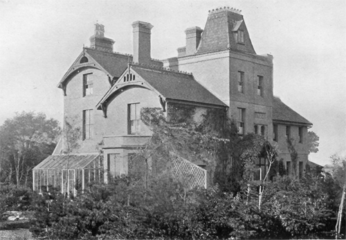 b&w photo of blocky house with turret